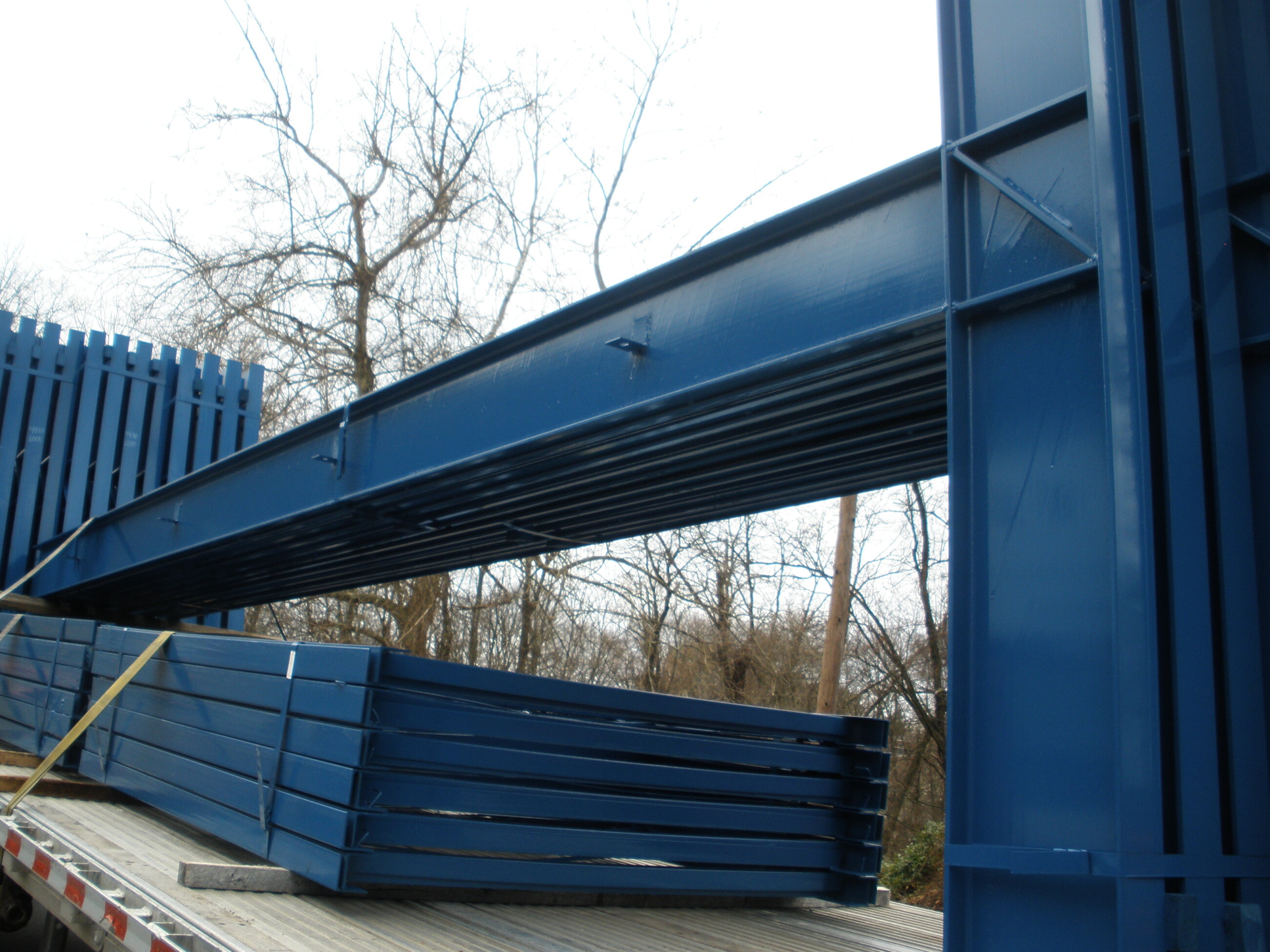 Heavy fabricated steel section lifted by crane in the shop