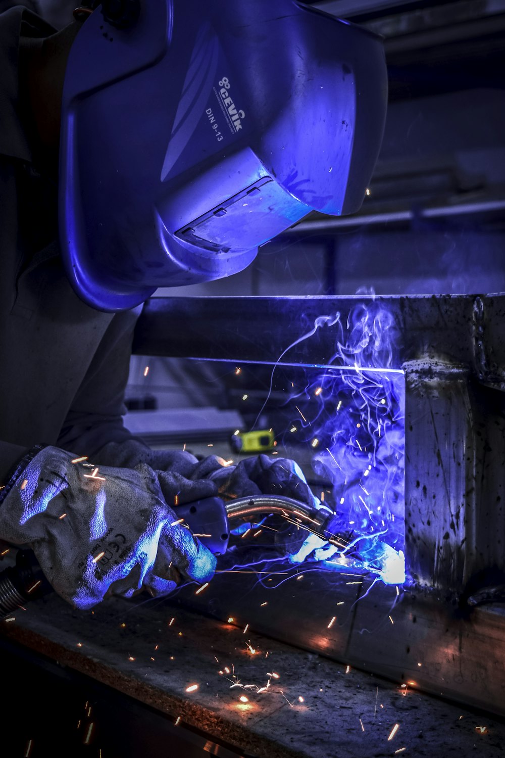 Welder fabricating a repeat steel frame assembly for an OEM production run